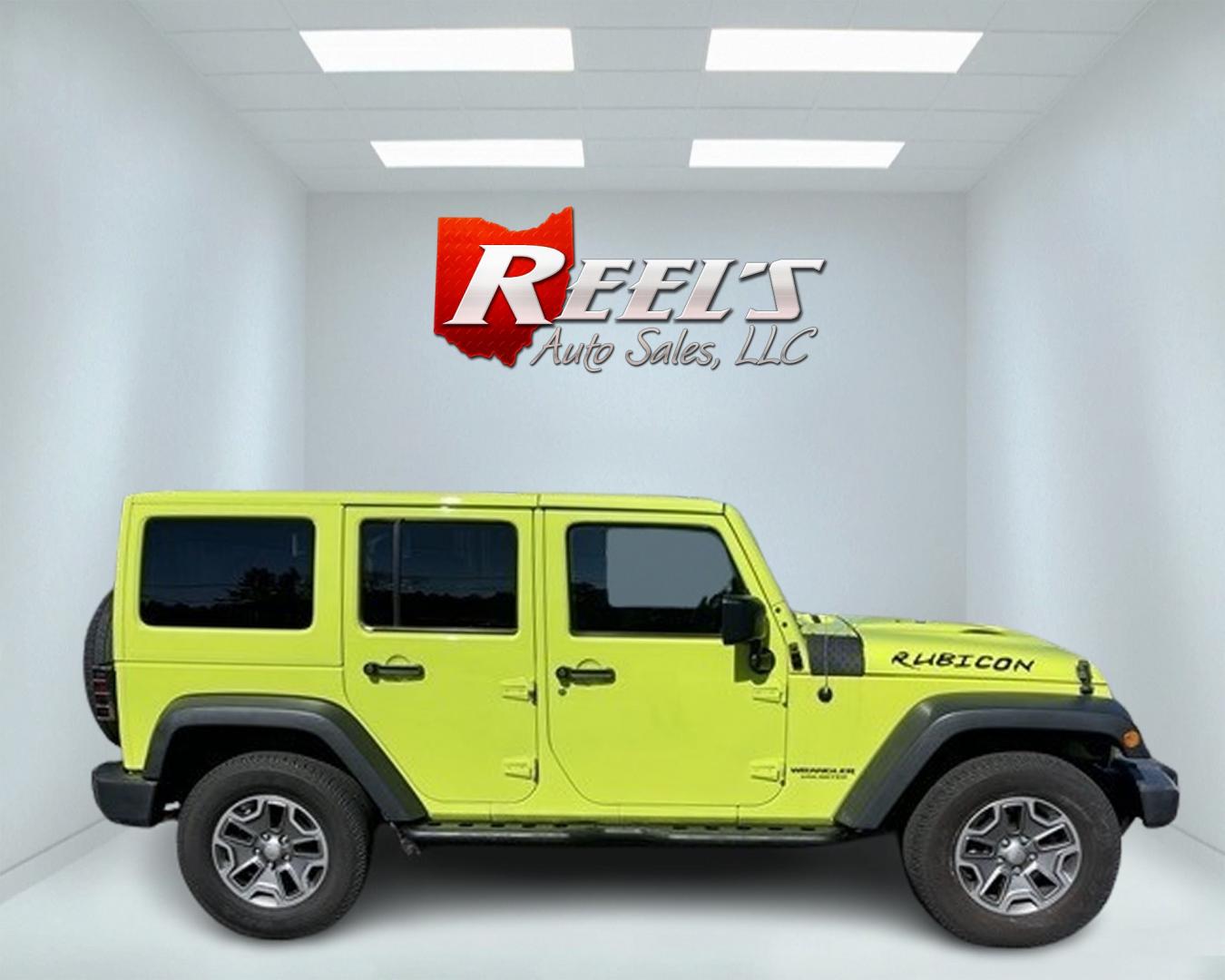 2017 Green /Black Jeep Wrangler Unlimited Rubicon 4WD (1C4BJWFG2HL) with an 3.6L V6 DOHC 24V engine, 5-Speed Automatic transmission, located at 11115 Chardon Rd. , Chardon, OH, 44024, (440) 214-9705, 41.580246, -81.241943 - This 2017 Jeep Wrangler Unlimited Rubicon is a rugged and capable off-road vehicle, equipped with a range of premium features. The exterior boasts LED headlights and fog lights, while the interior features a single-zone automatic climate control system, a 9-speaker Alpine sound system, and navigatio - Photo#4